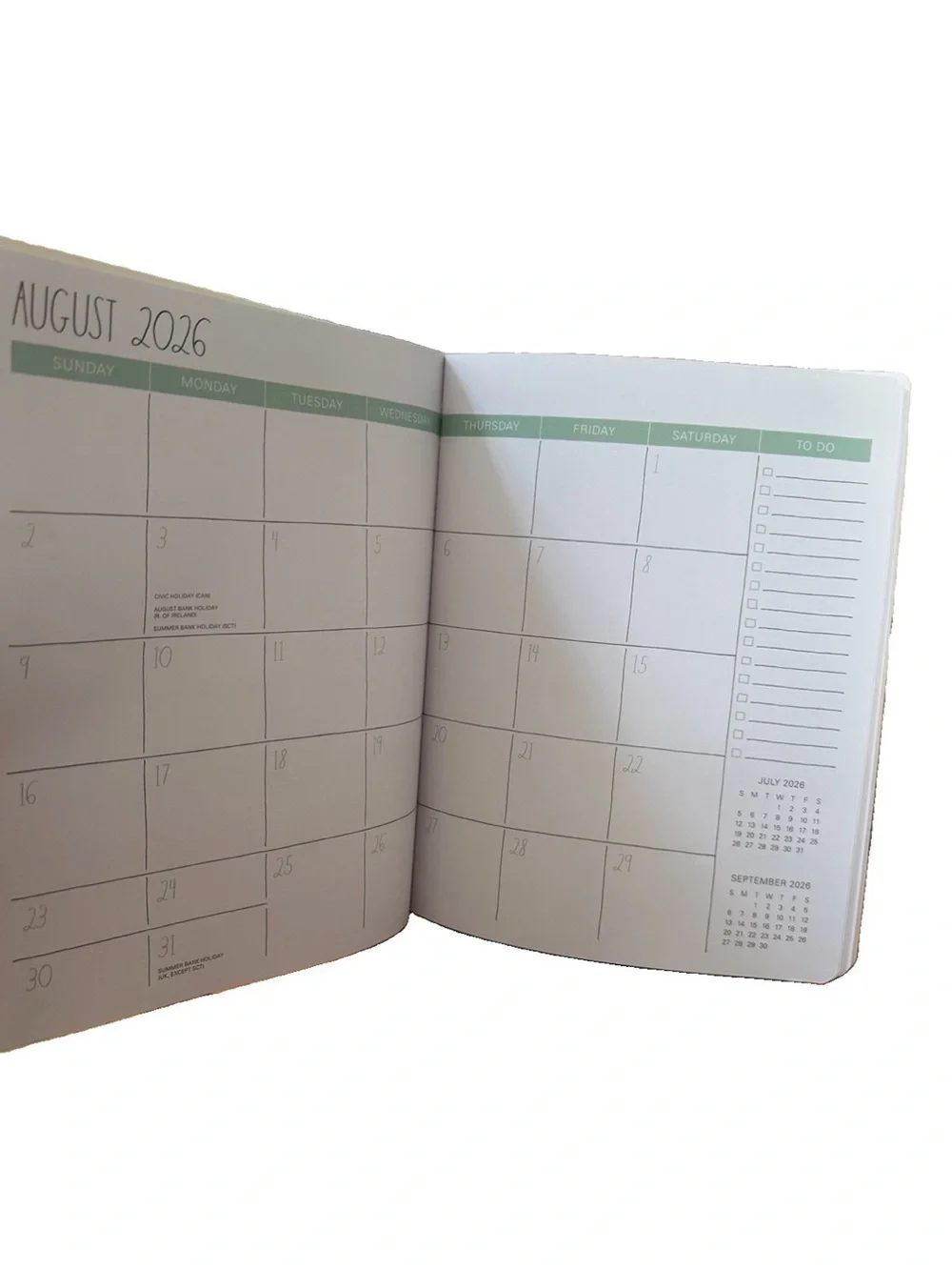 Rae Dunn 2027 PLANNER Soft Cover Spiral 17 months Planner  Ivory 9x7” Blue strip